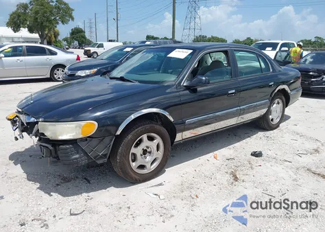 1999 Lincoln Continental из США, поврежденный, VIN 1LNHM97V5XY711570